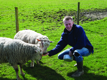 Tomorrow's Natural Leader Anthony with two sheep