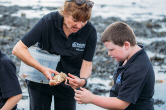 Emma helping school children