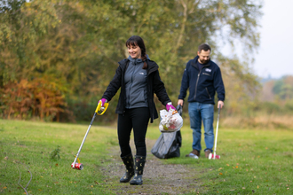 Two volunteers litter picking (credit: Jon Hawkins)