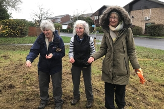 Members of a community spreading seeds