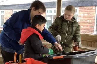 Children planting seeds