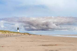 Spurn Point lighthouse and cloud