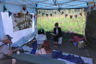 Picture of Jenna leading a storytelling session at Puffin Festival 2024