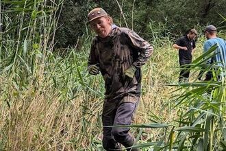 Volunteer trampling Himalayan Balsam