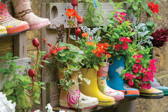 Welly planters overflowing with wildflowers