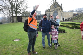 Visitors at the Action for Nature day, looking up into the sky