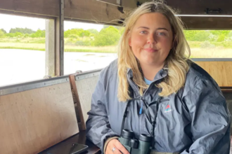 young birdwatcher in a bird hide