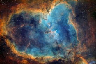 Cloud breaks around a blue stary sky