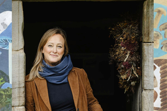 Author Sally Coulthard between fungi illustrations