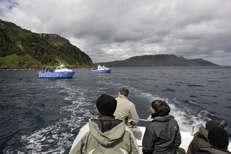 People watching and photographing sea eagles on Skye, Scotland. - Peter Cairns/2020VISION