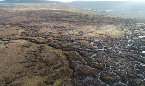 A peatland from the air showing bare peat and eroded gullies