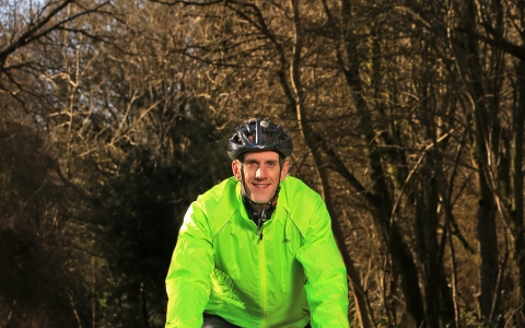 Richard cycling in a wood