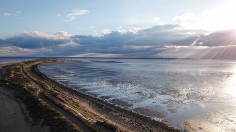 Image showing sun coming up behind clouds onto Spurn Point