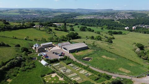 view of Stirley from a drone on a clear sunny day. You can see the site and farm buildings and rolling Yorkshire countryside.