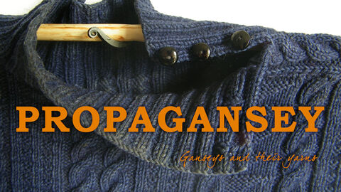 Image of a knitted blue gansey with the logo for Propagansey in orange over the top