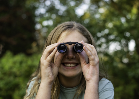 Child with binoculars