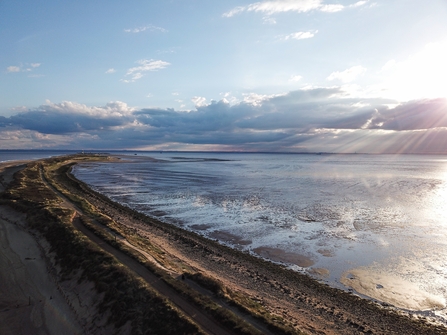 Image showing sun coming up behind clouds onto Spurn Point