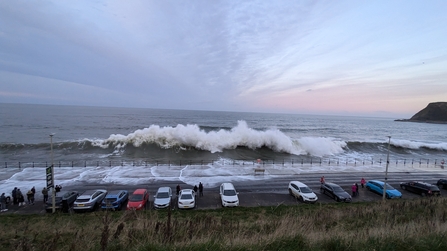Large waves crashing over the road at Scarborough seafront