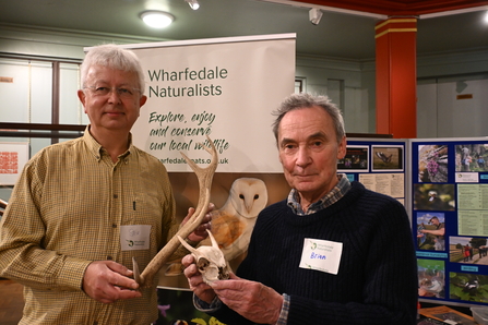 2 members of Wharfedale Naturalists holding antlers and skulls they have found