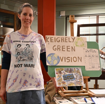 Keighley Green Vision stand with woman standing in front