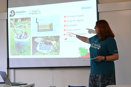 YWT's Jo giving a talk in front of a screen