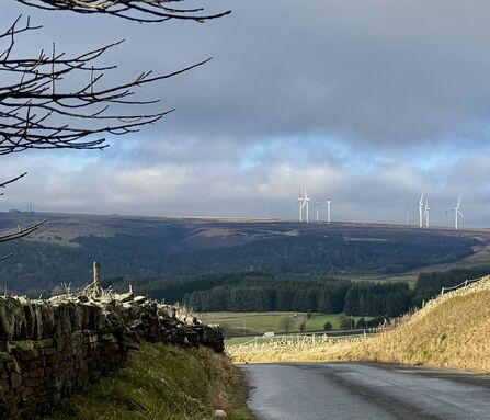 Wind turbines on distant moorland in the South Pennines