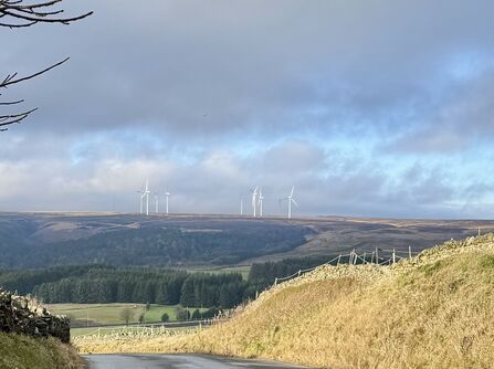 Wind turbines on distant moorland in the South Pennines