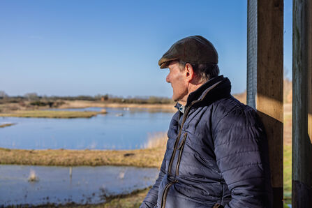 Stephen Martin looking out at village lake at North Cave Wetlands