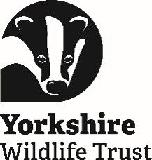 Logo of the Yorkshire Wildlife Trust featuring a black and white illustration of a badger's head within a circle, with the text "Yorkshire Wildlife Trust" below.