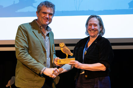 Tamsin Constable, right, accepts an award from Wildlife Trusts CEO Craig Bennet (left).