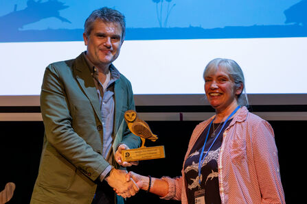 Ann Hanson (right) accepts an award from Wildlife Trusts CEO Craig Bennett (left)