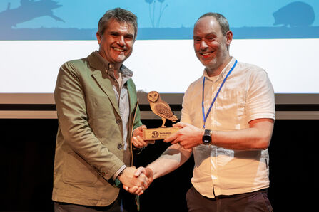 Dr Richard Grayson (right) accepts an award from Wildlife Trusts CEO Craig Bennett (left)
