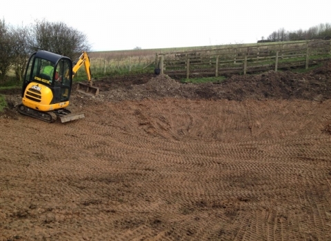 Adding clay to dew pond