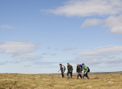 Group walking across moorland