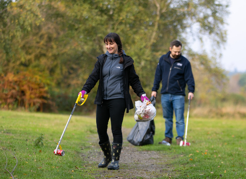 Two volunteers litter picking (credit: Jon Hawkins)