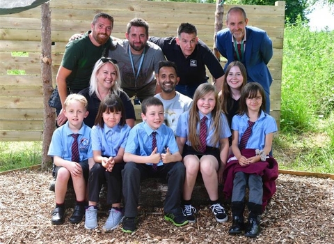 School group sitting with Dr Amir Khan