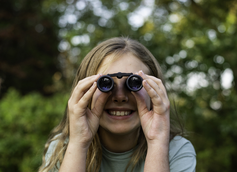 Child with binoculars