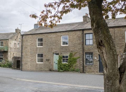 A photograph of Aske House. A beautiful stone holiday cottage.