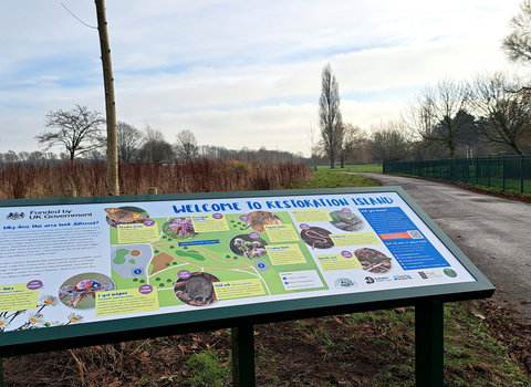 interp panel on an open community green space